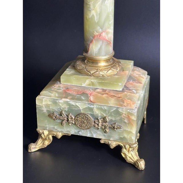 19th century French onyx victorian candelabra. Natural onyx with rust red veins. Bases have decorative brass legs in the...