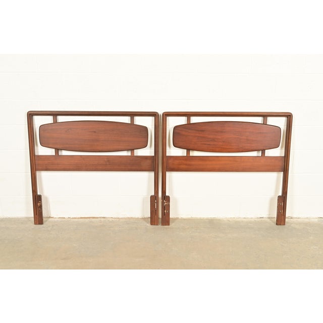 An exceptional pair of Mid-Century Modern sculpted walnut twin size headboards By Lane, "Rhythm" Collection USA, 1960s...