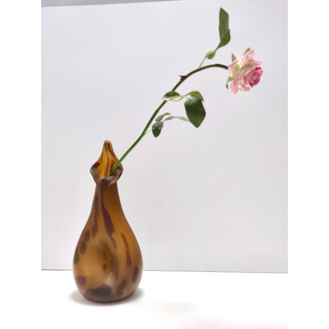 Made in Italy, 1940s - 1950s. This vase is made in amber Murano glass and is likely to be a experimental vase, as it is...