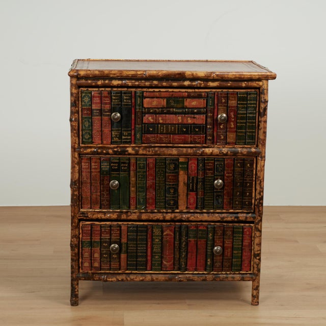 Impressive 19th century English chest with a tooled leather top on a burnt bamboo case with three drawers with brass pulls...