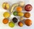 This set of carved stone fruit from Italy includes oranges, lemons, apples, a banana, nectarines, a walnut, a peach, and a...