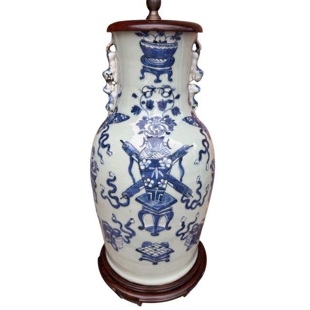 A beautiful pair of antique Chinese light celadon glazed vase table lamps, featuring navy blue hand-painted decorative...