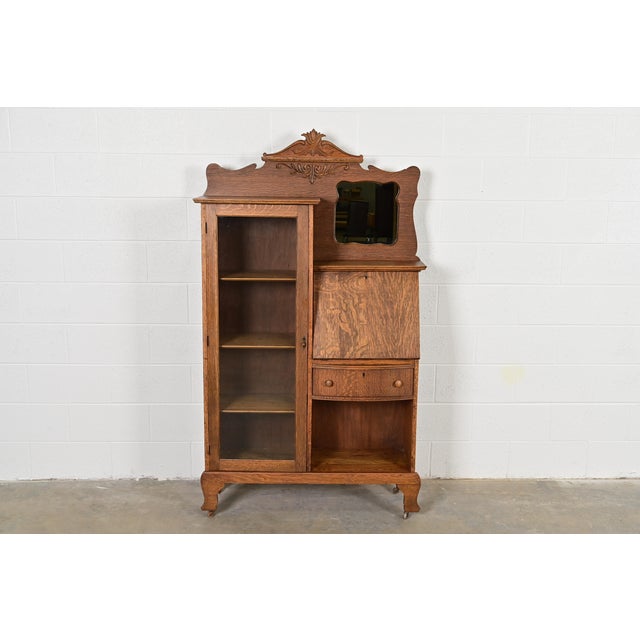 A gorgeous antique Victorian side-by-side drop front secretary desk and bookcase or display cabinet By Larkin Co. USA,...