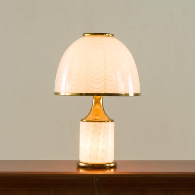 This elegant and sculptural table lamp was designed by romeo rega and manufactured in italy during the 1980s by f. Fabbian...