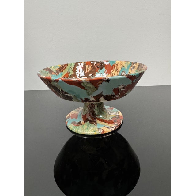 Pedestal bowl handmade in France. The long and meticulous technique consists of kneading different color clays obtained by...