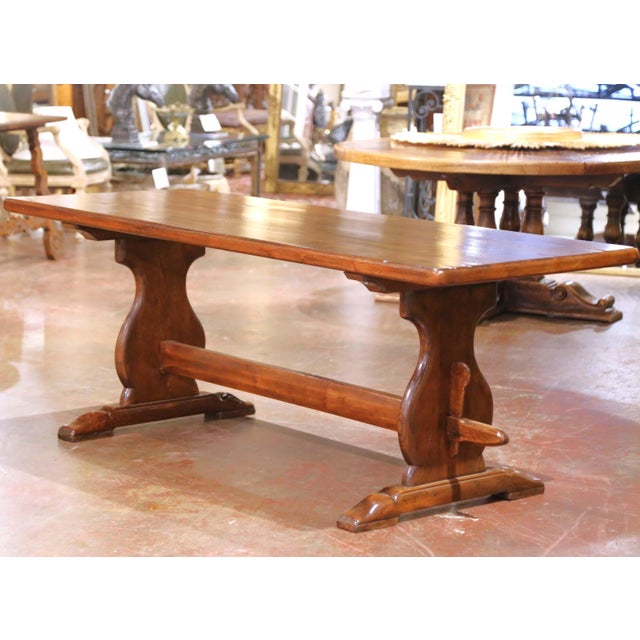Crafted in France circa 1880, this antique refectory or monastery table is made of solid elm with a rich, warm patina. The...