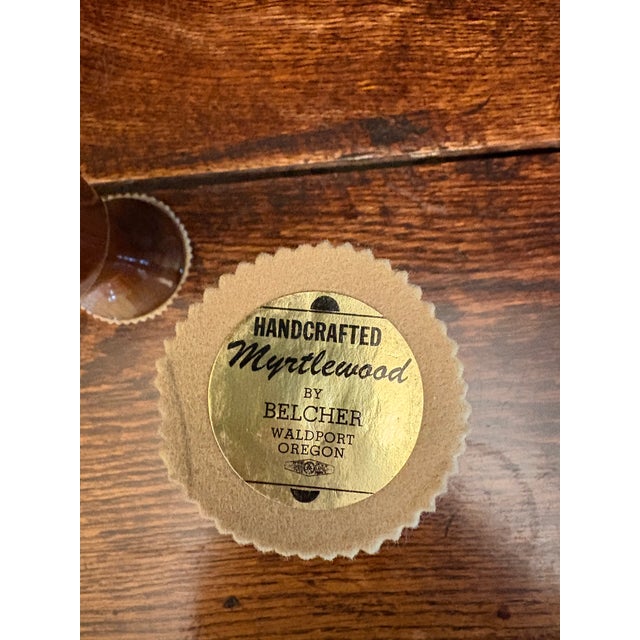 This pair of vintage bud vases is handcrafted from Oregon myrtlewood by Belcher of Waldport, a maker known for high-...