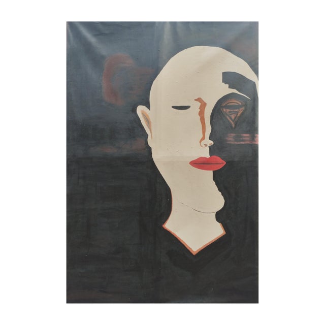 A face divided stands in quiet tension, one half steady, composed, trying to hold the line; the other half swallowed by...