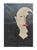 A face divided stands in quiet tension, one half steady, composed, trying to hold the line; the other half swallowed by...