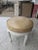 A glamorous antique swivel stool restored in a rich patent leather stamped in a reptile pattern. Base is painted in an...