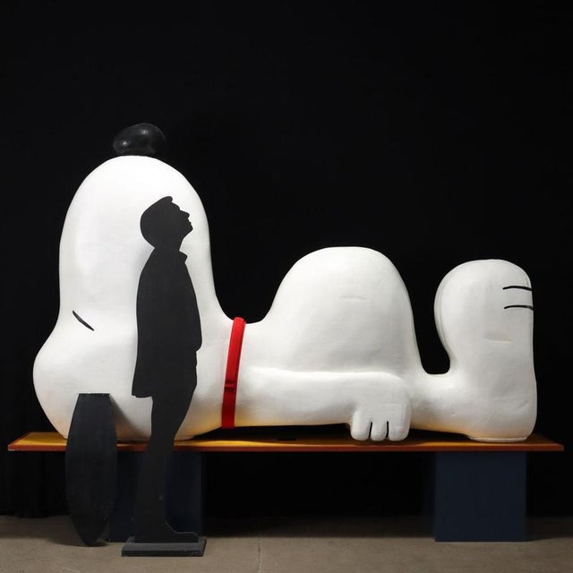 Giant Snoopy in white lacquered polystyrene with iron ears, depicted lying down with his nose up. Ideal for set designs,...
