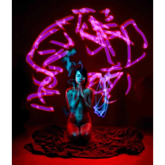 Light painting technique, realized in the dark duck studio, whertiother "paint" by torch with light of different colours,...