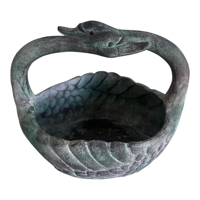 Vintage decorative swan-shaped vessel that can be used as a planter, cachepot, centerpiece, or simply as an ornamental...