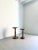 A handsome pair of hand turned wooden side tables in complementary sizes. This set of 20th Century occasional tables has...