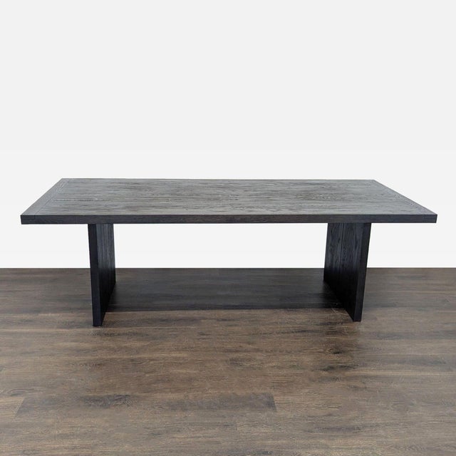 This worn oak dining table has a naturally minimalist look and seats 8. The table is constructed of solid oak and oak...