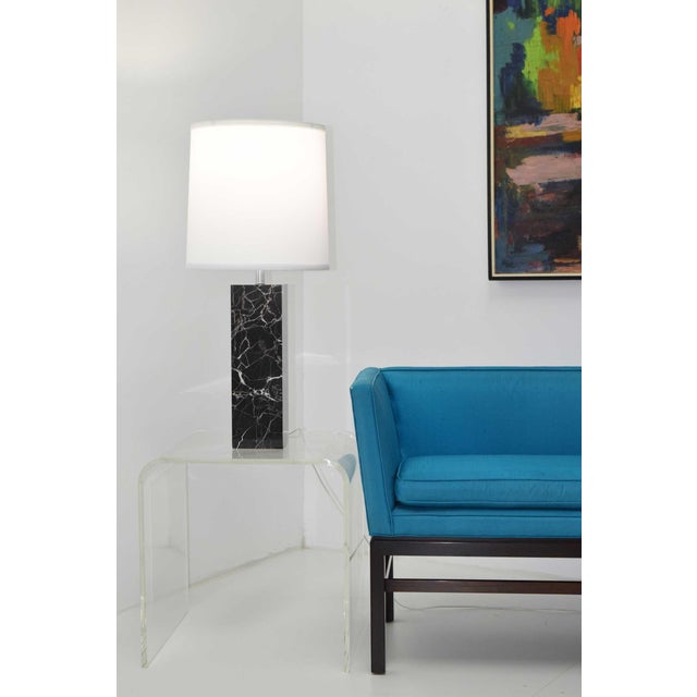 Enhance your home with a beautiful pair of black and white veined marble block table lamps by Nessen Studio, exclusively...