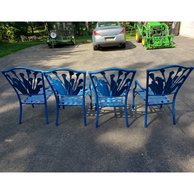 Offering a unique set of cast aluminum chairs for use as dining chairs or just group sitting. The chairs have wide vinyl...