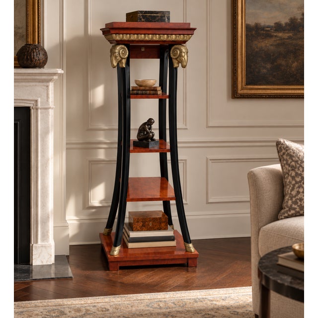 Inspired by a 19th-century German neoclassical design, the piece features rich cherry-finished shelves and a stepped...