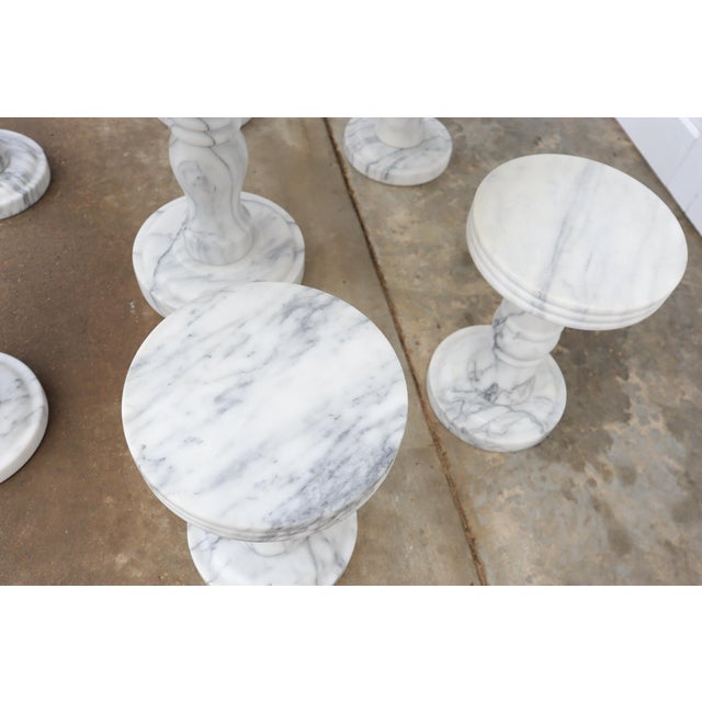Super elegant solid Italian carrara marble bistro dining table with 6 matching revolving/rotating stools. They are all in...