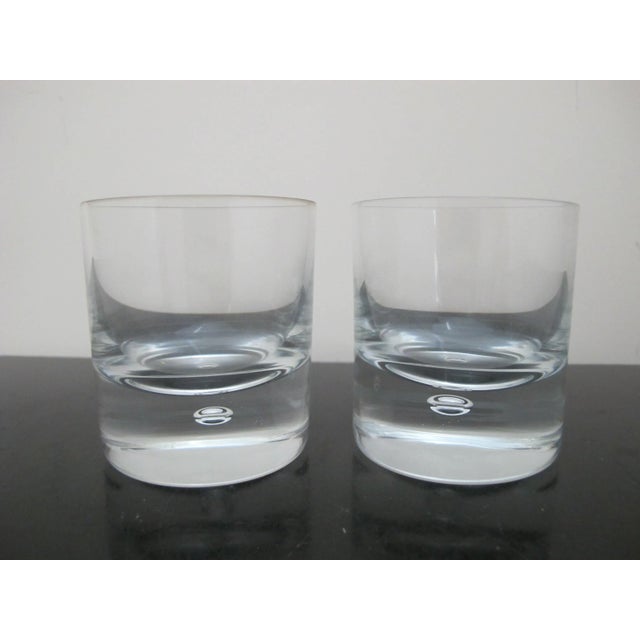 Kosta Boda, mid century modern style 'Pippi' cocktail tumbler pair. Clear glass with single suspended air bubble. Each...