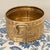 Solid brass oval bowl made in India featuring richly embossed floral and foliate motifs and a striking pair of...