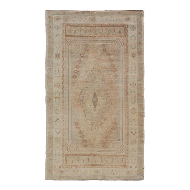 Vintage Oushak Rug From Turkey With Muted Colors and Tribal Medallion For Sale