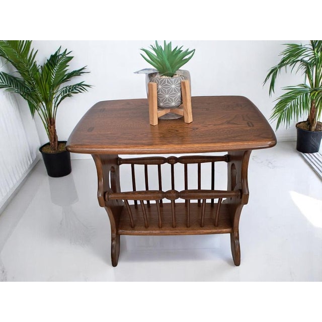 Exquisite Ercol Magazine Rack/Side Table – A Timeless Classic Introduce a touch of sophistication to your home with this...