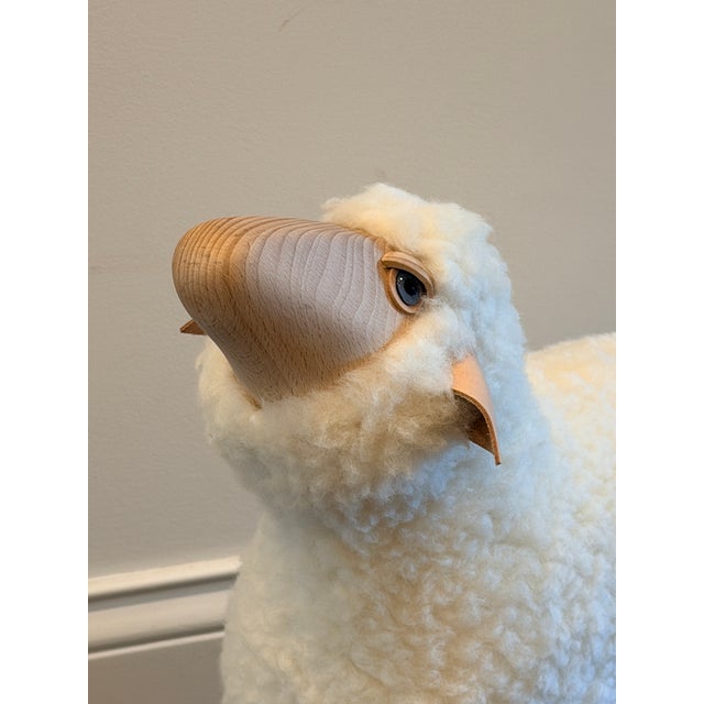 Charming sculptural sheep by Meier Germany, crafted in wood with a soft ivory wool body, carved natural wood head and...