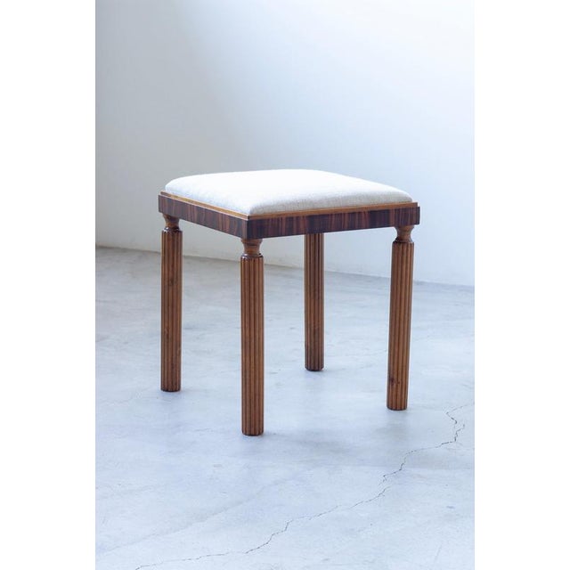 Swedish Grace stool designed and made in Sweden during the 1920s. High quality craftsmanship with fluted legs and zebrano...