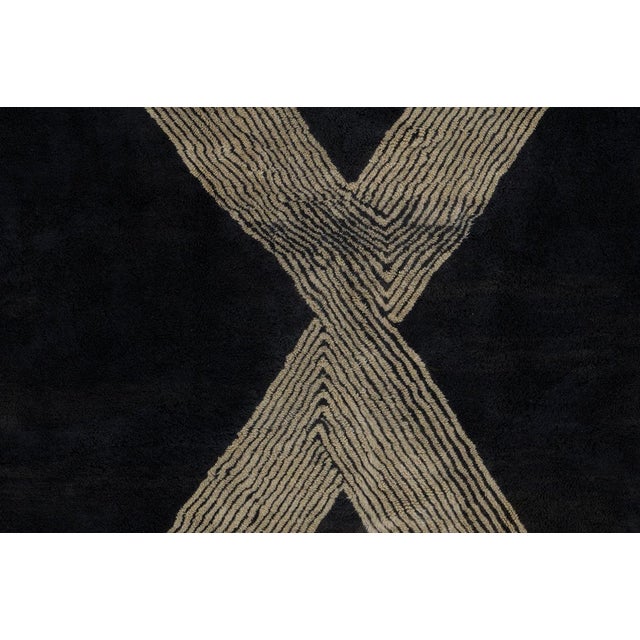 Luxurious hand-knotted wool rug in deep Charcoal Black with a bold, intersecting Antique White stripe pattern. The...
