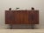 The highboard was made in the 1960s, Danish production. The structure is covered with walnut veneer. Legs made of metal...