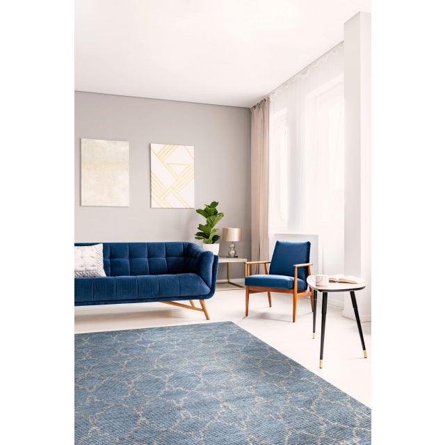 Versatile Agra Blue Hand Knotted Wool Rug, Country of Origin: India. This exceptional piece is defined by its deeply...