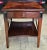 A 20th Century Hickory Chair Company Fruitwood Tiered Stretcher Side Table. Measures 23 x 27 x 26 . Lower tier clearance...