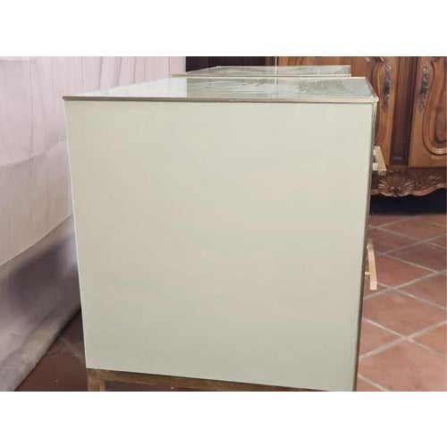 This pair of white Murano opaline bedside tables with brass fittings and legs is a splendid example of mid-century modern...