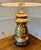 This vintage brass lamp is cherished for its timeless appeal and durability, frequently becoming a family heirloom. The...
