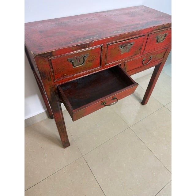 Authentic antique Chinese red lacquer console table with original brass hardware and five drawers. Solid hardwood...
