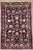 Antique hand-knotted rug from the Hamedan region of western Iran, featuring a dense allover floral design on a deep navy...