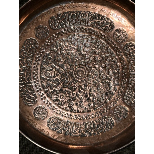 This Persian copper over tin Charger is a stunning example of traditional Middle Eastern metalwork. It is hand forged and...