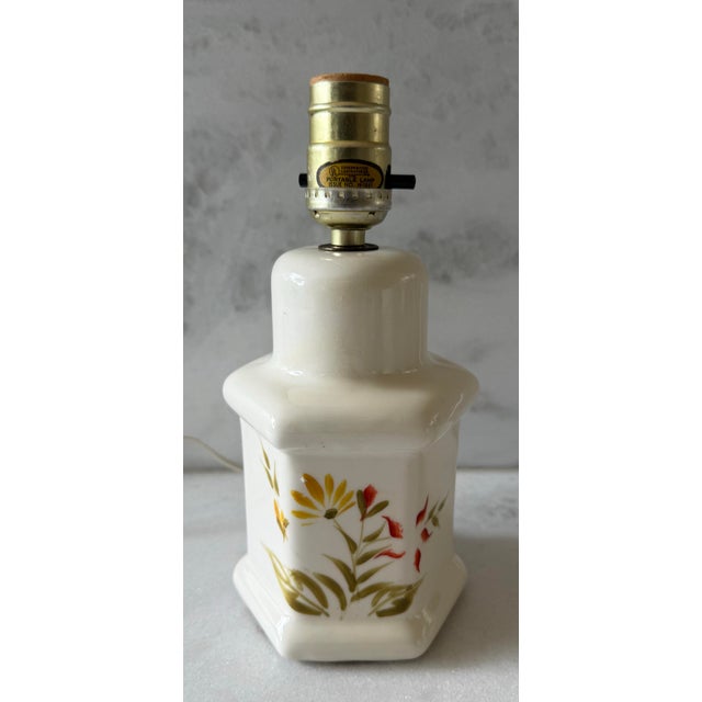 Vintage white ceramic ginger jar table lamp with a hand painted yellow, red and green floral design. Small adorable size,...