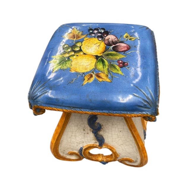 This striking vintage Italian majolica ceramic stool showcases classic Mediterranean craft with a playful, trompe-l'œil...