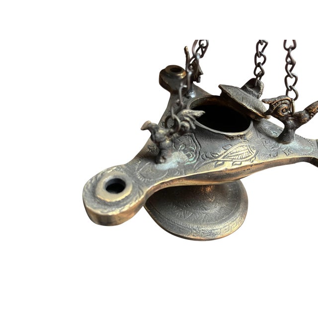 Transform your home into a sanctuary with this intricate Brass Hanging Incense Burner. Modeled after ancient oil lamps,...