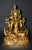 A beautiful gilt bronze statue of Tibetan Green Tara. The goddess is seated in lalitasana on an elaborately incised...