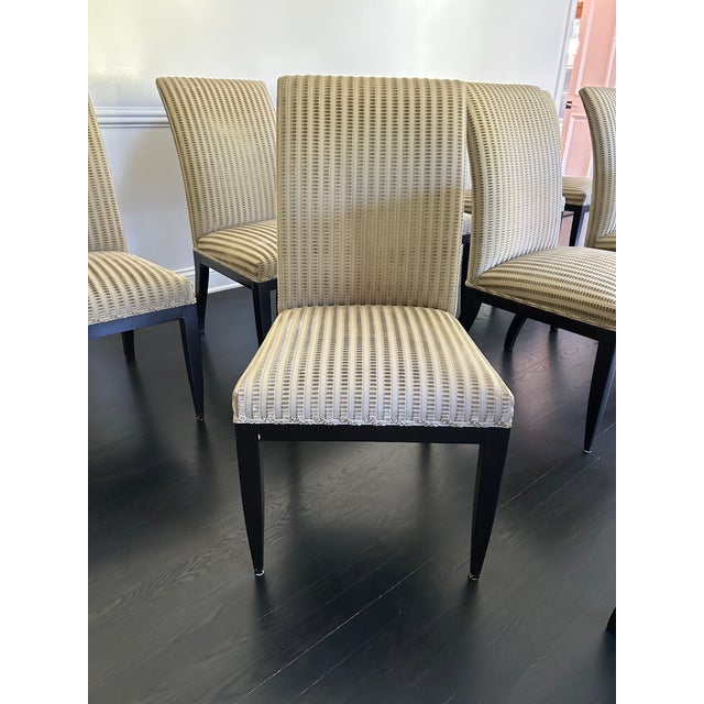 Set of 12 Artistic Frame dining chairs in pristine condition with designer Bergamo olive green fabric. 2 elegant arm...