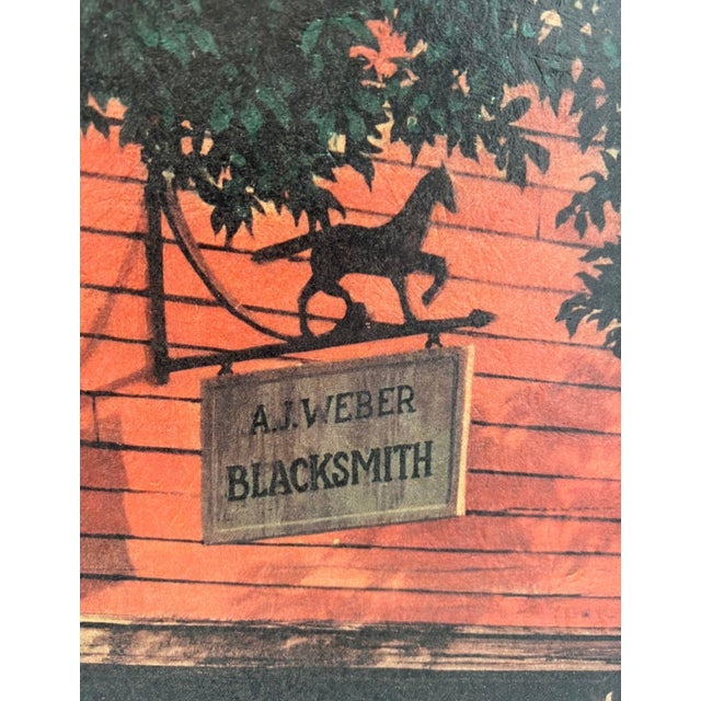 This vintage framed print depicts The Village Blacksmith in "Horse and Buggy Days" a nostalgic rural scene after the work...