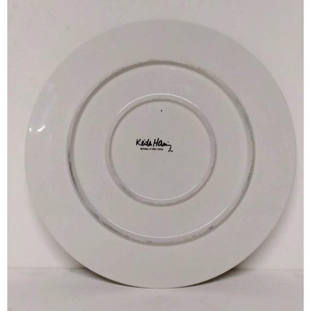 Two multiples plates in ceramic, created by Haring Keith in the 1990s. Number unknown. Marked under the plates. This piece...
