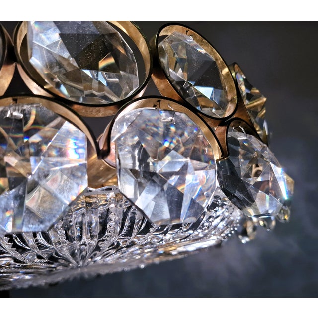 A beautiful chandelier by palwa (palme & walter) from germany, made of gold-plated brass and featuring cut crystal...