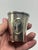 This appears to be a vintage alpaca silver beaker or tumbler, featuring a clean tapered form accented by an applied...
