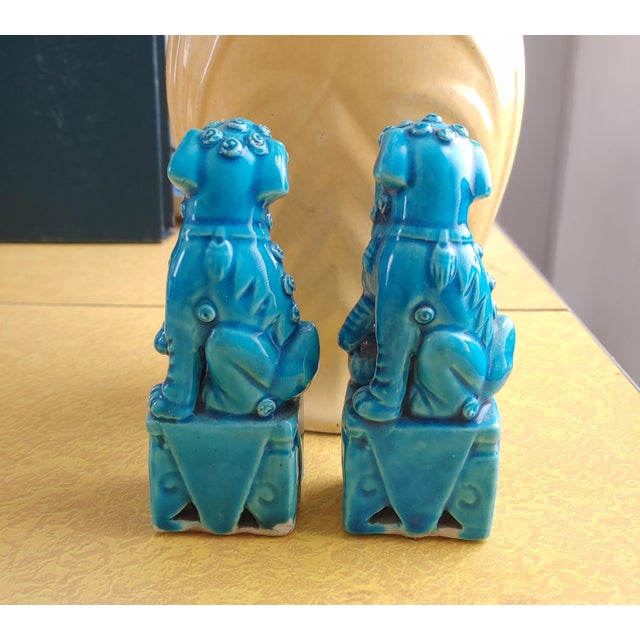 Here's a bright turquoise pair of bookends in the shape of Chinese foo dogs. Nicely detailed faces. Traditional design...