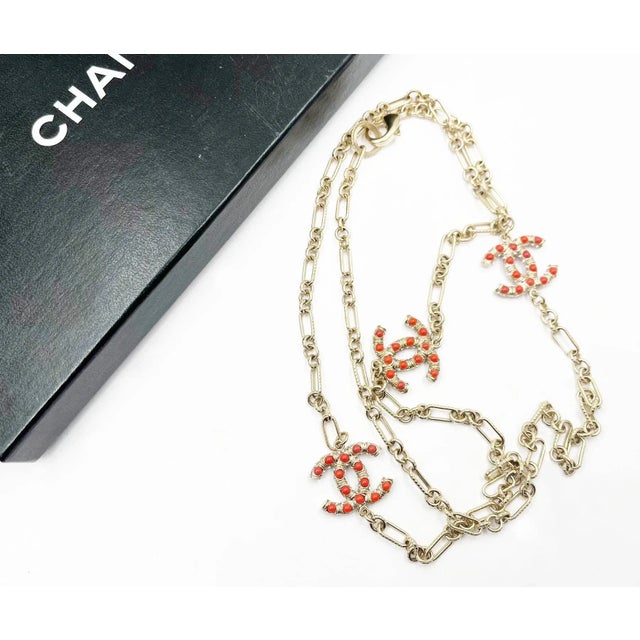 Chanel Gold CC Red Bead Chain Necklace *Marked 08 *Made in Italy *Comes with original box -Approximately 40″ long total...