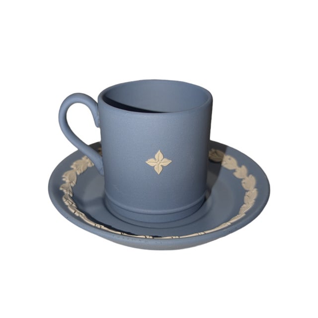 This Jasperware Demitasse Cup is decorated with a raised bas relief of Wedgwood's "Dancing Hours" motif, which dates from...